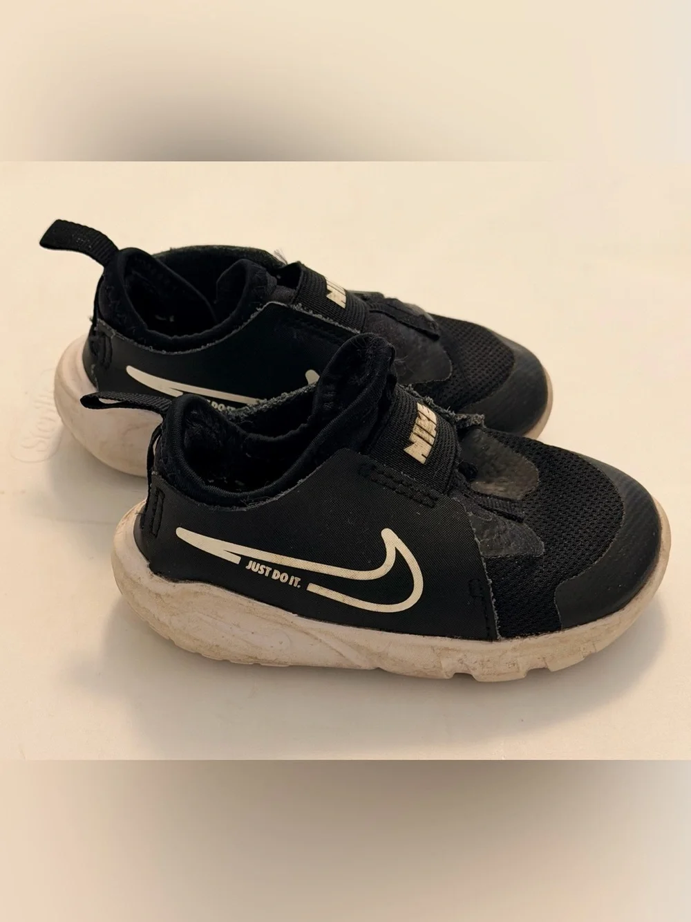 Nike Toddler Black and White Slip-On Sneakers